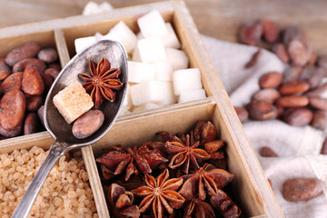 Wooden box with set of coffee and cocoa beans, sugar cubes,