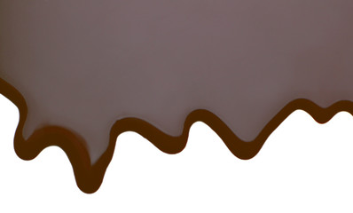 Melted chocolate dripping on white background