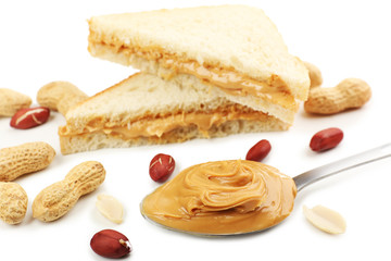 Creamy peanut butter in spoon, close-up