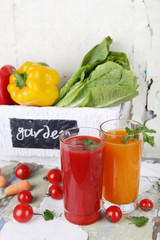 Vegetable juice and fresh vegetables in wooden box