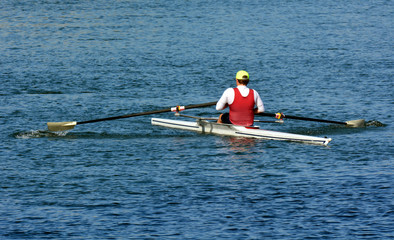 Man rowing a rowboat © Rafael Ben-Ari