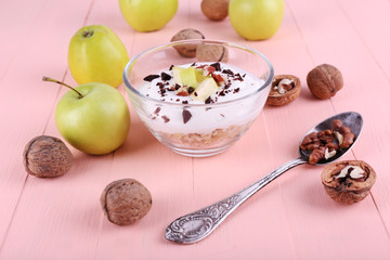 Oatmeal with yogurt in bowls/bowl, apples and walnuts