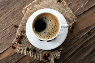 Cup of coffee on wooden table