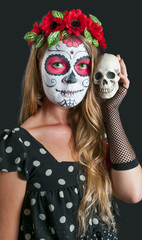 Girl with Calavera Mexicana makeup mask. Helloween