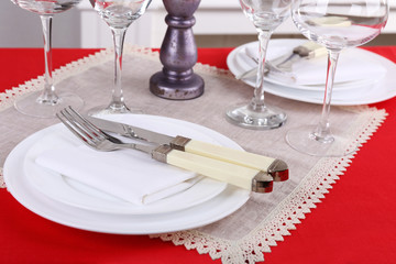 Festive table setting on room background