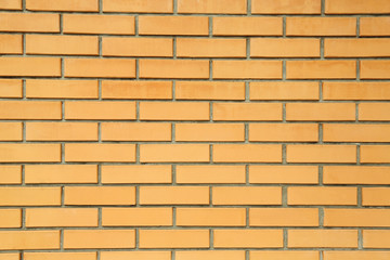 Orange brick wall close-up background