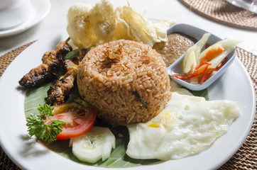 nasi lemack style dish fresh vegetables nuts and fish with rice popular across indonesia and malyasia