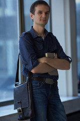 businessman with a bag and a book