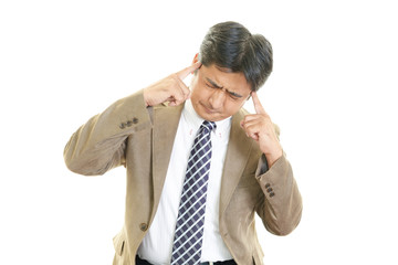 頭痛を訴えるビジネスマン