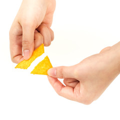 Cracking tortilla chips from colorful dish on white background