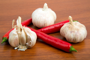 Chile peppers and garlic on the wooden table