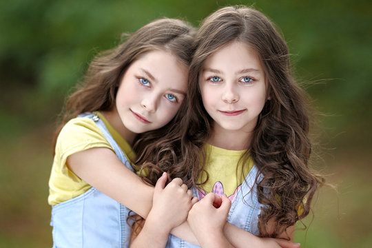 Portrait of two little girls twins