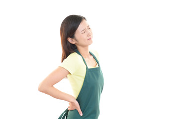 腰痛を訴える女性