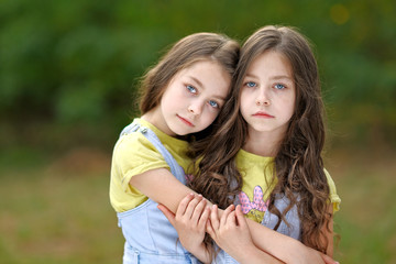 Portrait of two little girls twins