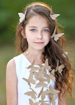 portrait of little girl outdoors in summer