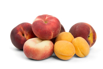 juicy ripe apricots and peaches on a white background