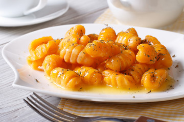 pumpkin gnocchi closeup on a white plate