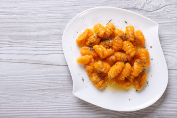 pumpkin gnocchi with sauce and spices, horizontal top view