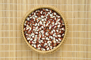 Wicker plate with grains beans