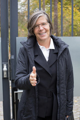 businesswoman standing at the door