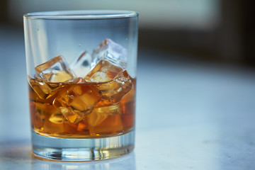 whiskey with ice on a table