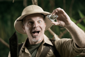 Explorer finding a huge gem in the jungle © stokkete