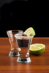 Two glasses of tequila salt and lime