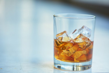 whiskey with ice on a table