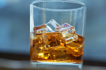 whiskey with ice on a table