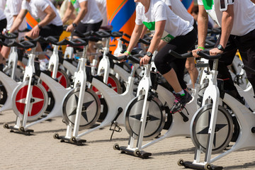 Fototapeta premium Stationary spinning bicycles outdoor in a sunny day. aerobic