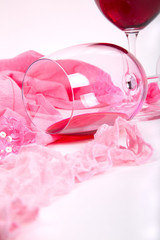 two glasses of red wine on a white background of about pink pant