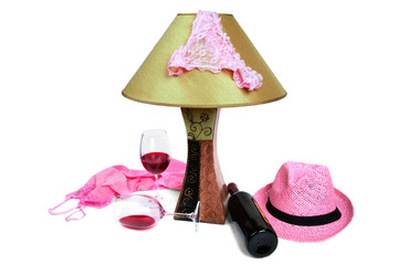 panties on the lamp near the bottle of wine and two glasses