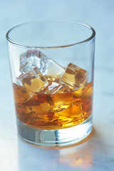 whiskey with ice on a table