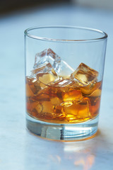 whiskey with ice on a table