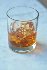 whiskey with ice on a table