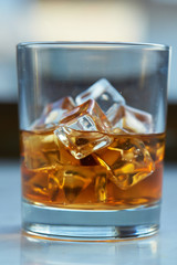 whiskey with ice on a table
