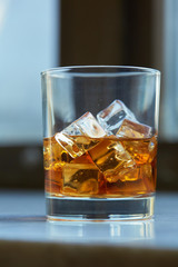 whiskey with ice on a table