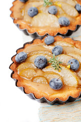 Homemade pear and blueberry tarts