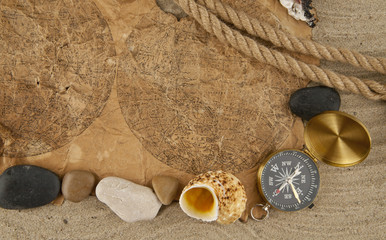 cockleshells, stone, paper and compass