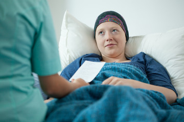 Doctor examining sick woman