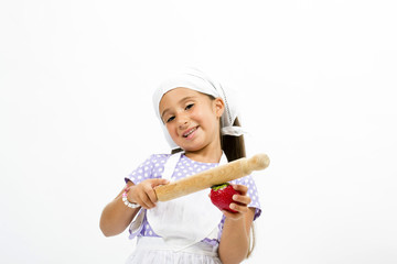 Small smiling chef with kitchen utensils and strawberry