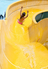 Children play on the water slide