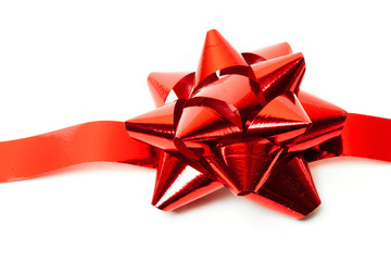 Gift red ribbon and bow isolated on white.