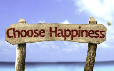 Choose Happiness sign with a beach on background