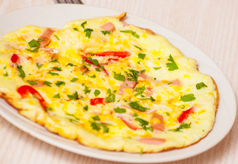 omelette with ham, vegetables and cheese