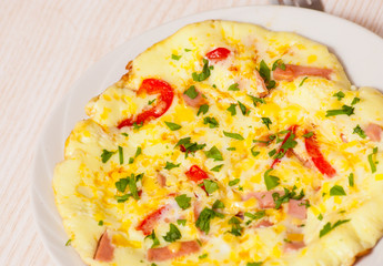 omelette with ham, vegetables and cheese