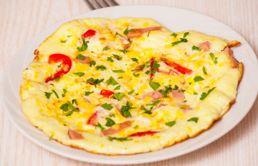 omelette with ham, vegetables and cheese