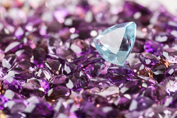 Natural Topaz stone on background of natural amethyst
