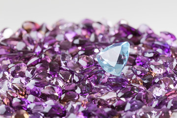 Natural topaz on background of natural amethyst