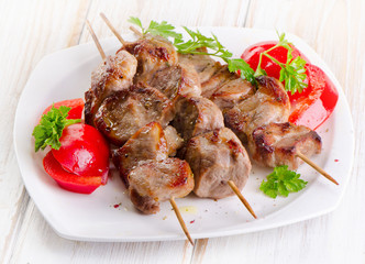 Pork kebabs served  on   plate